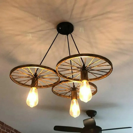 lustre roue de chariot
suspension style rétro
suspension ampoule Edison
lustre industriel noir